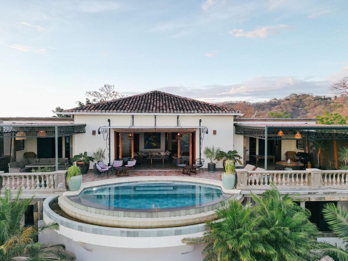 Villa pool and terrace with jungle and Pacific hills beyond